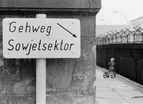 Thomas Hoepker, Child with Scooter at the Berlin Wall. This pedestrian way belongs to the Soviet Sector of Berlin. Berlin, Germany, 1963. © Thomas Hoepker / Magnum Photos.